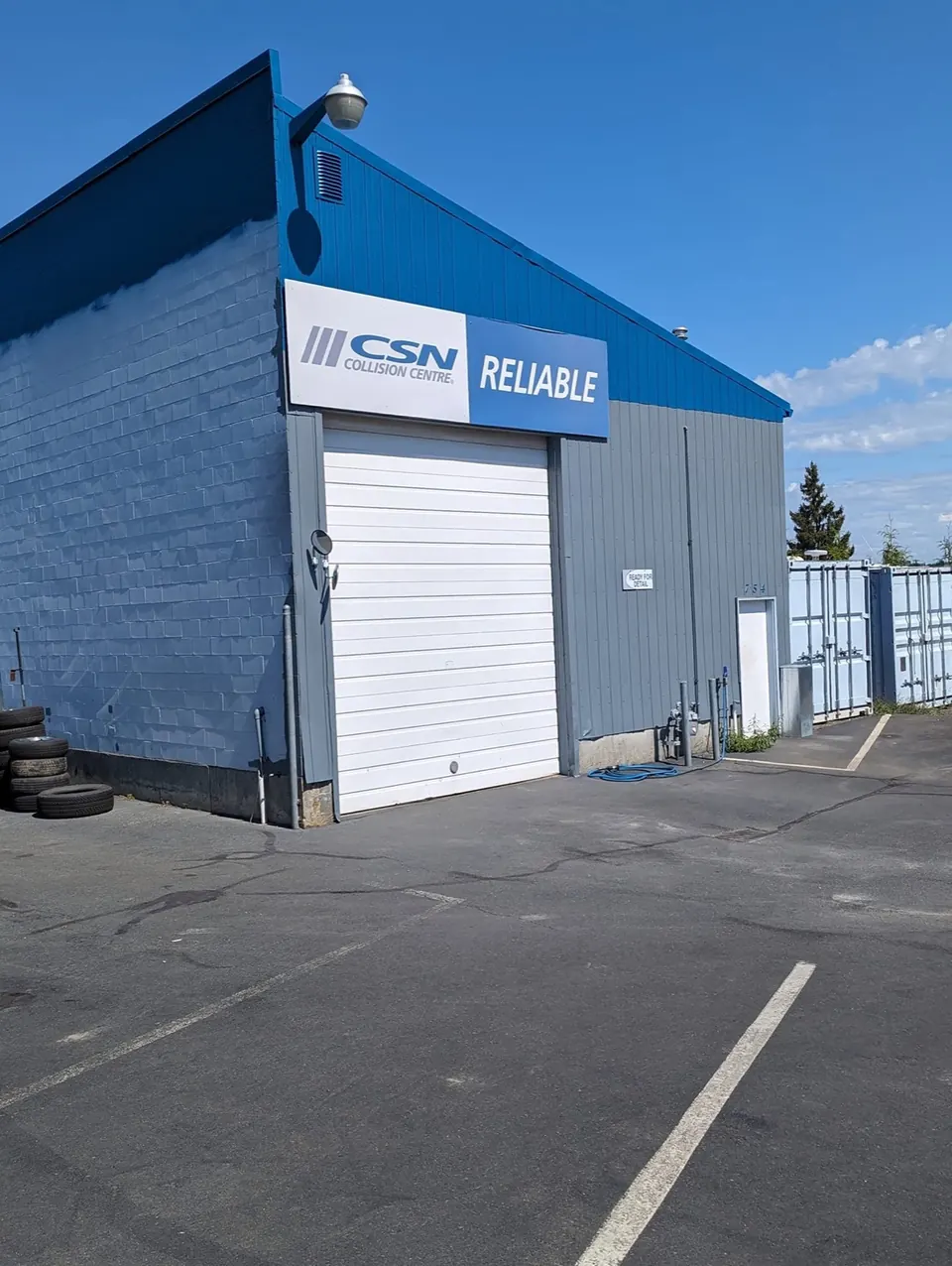 CSN Reliable Auto Body shop painted grey with blue trim